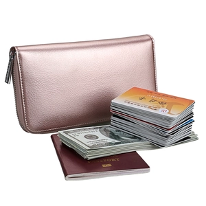 Detailed view of rose gold leather wallet capacity with passport and cards inside