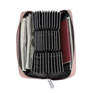 Macro detail of pink leather wallet showing 36 card slots and RFID protection layers