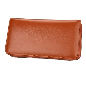 Detailed view of brown leather accordion wallet with metal zipper and fine stitching