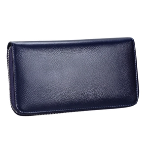 Detail of navy blue pebble leather long wallet with secure silver zipper closure