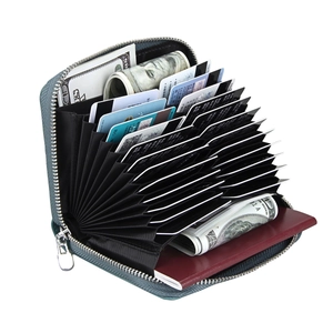 Detail of blue RFID leather card holder with multiple organ slots and cash pocket