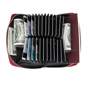Internal view of red RFID card holder showing accordion slots for cards and passport storage