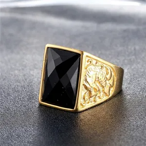 Vintage men's gold plated ring with large rectangular black onyx gemstone and dragon relief