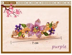 Detailed view of a 7cm purple enamel floral hair clip with crystals and gold finish