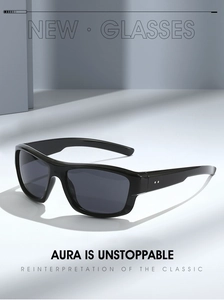 Detail view of black square sunglasses featuring metallic rivets and dark grey lenses