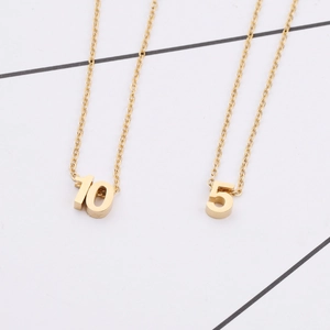 Polished golden stainless steel necklaces featuring Arabic number pendants 10 and 5