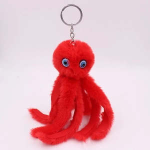 Close-up of red plush octopus keychain with soft fur texture and durable metal ring
