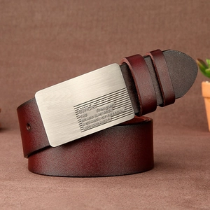 Detailed view of brown leather belt with vintage silver buckle on professional background