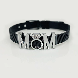 Macro detail of MOM charm on black stainless steel mesh bracelet with buckle clasp