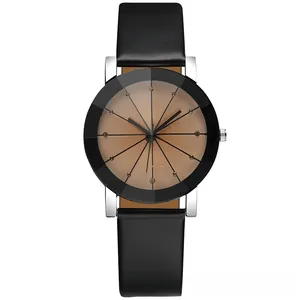 Close-up of diamond-cut faceted glass cover on stylish quartz watch with leather strap
