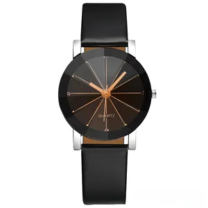 Detail of multi-faceted geometric glass dial on black leather strap quartz watch
