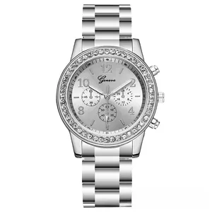Close-up of silver Geneva steel watch with diamond-set bezel and three decorative sub-dials