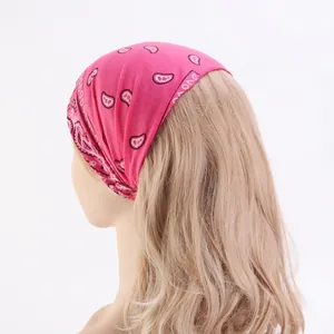 Women's pink paisley print headband made of stretchy cotton for sports and casual wear