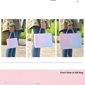 Detail showing small, medium and large gradient gift bags with white rope handles