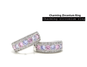 Detail of pink and light blue zircon wedding rings with micro-pave and beaded edges
