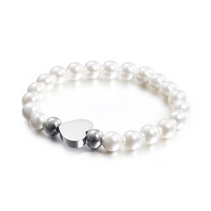 Elegant white pearl bracelet with polished silver heart charm on clean white background