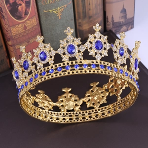 Detailed side view of golden baroque bridal crown with blue gemstones and rhinestones