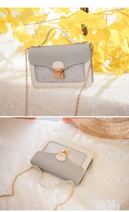 Detail of star-sequined crossbody bag with gold chain strap and stylish patchwork design