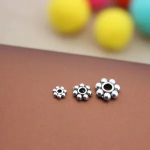 Vintage silver flower spacer beads in three sizes for DIY jewelry making and bracelets