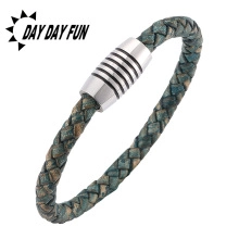 Detail view of woven leather bracelet with multi-color cord and silver magnetic clasp