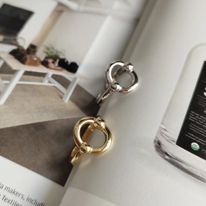 Detail of minimalist 925 sterling silver rings with geometric interlocking design