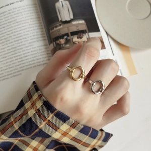 Detailed view of adjustable gold and silver minimalist rings with bead accents