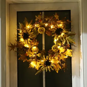 Fall wreath with green pumpkins sunflowers and LED lights for Thanksgiving home decor