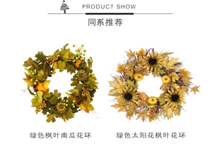 Detail view of autumn wreaths with green maple leaves, pumpkins and sunflowers