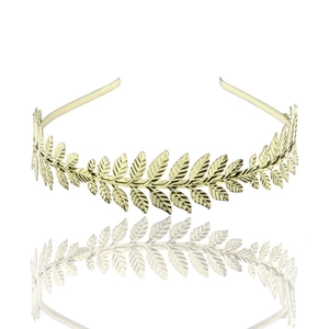 Elegant golden metal leaf headband Baroque bridal hair accessory on white background