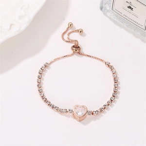 Close-up of rose gold heart bracelet with zircon stones and adjustable bolo clasp