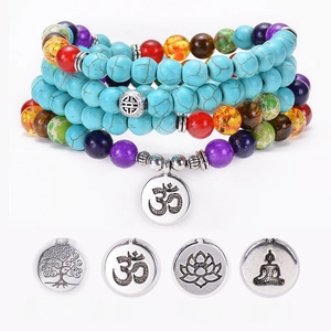 Bohemian multilayer turquoise bead bracelet with OM, Lotus, and Tree of Life charms