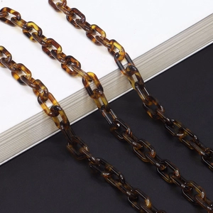 Tortoiseshell resin eyeglass chain with amber acrylic links and polished finish
