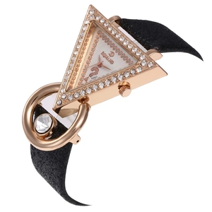 Macro detail of triangle rhinestone bezel with frosted strap and metal ring charm