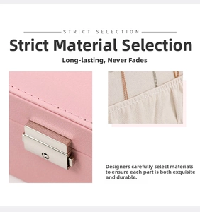 Detail of pink PU leather jewelry box featuring a silver metal lock and velvet interior