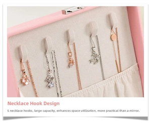 Pink jewelry box interior featuring five necklace hooks and soft velvet lining details