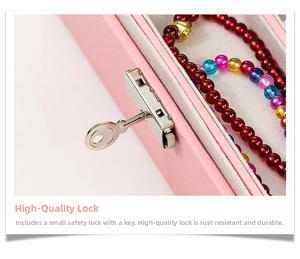 Detail of the high-quality metal lock and key on the pink leather jewelry storage box