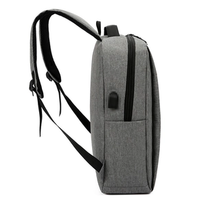 Slim grey waterproof business backpack with side USB charging port for laptops