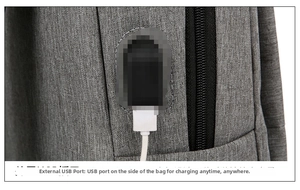 Detail of grey oxford backpack featuring a built-in USB charging port and white cable