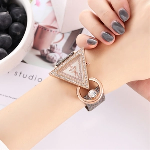 Fashionable triangular rose gold watch with rhinestone inlay and glitter strap on wrist