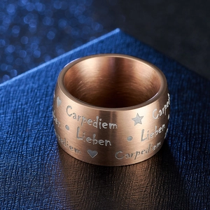 Matte rose gold Carpe Diem ring with brushed metal texture and engraved stars
