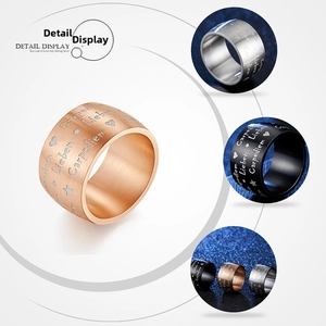Detail view of matte black and silver Carpe Diem engraved wide band rings
