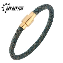 Detailed view of dark blue woven leather bracelet with golden magnetic cylinder clasp