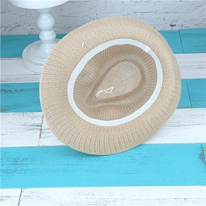 Classic beige woven straw sun hat featuring adjustable inner sweatband and wide brim