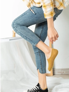 Close-up of ginger yellow low cut no-show socks with non-slip silicone heel grip for women