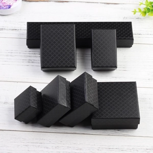 Detailed view of black jewelry gift boxes with elegant diamond texture in various sizes