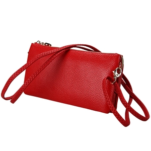 Stylish red lychee grain genuine leather crossbody bag with golden hardware on white background