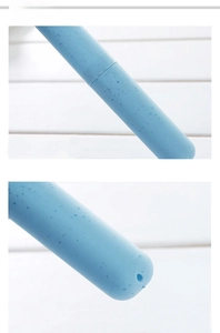 Close-up of sky blue portable toothbrush holder with wheat fiber texture and vent holes