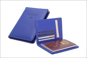 Detailed view of the RFID blue leather passport holder with slots for cards and travel documents