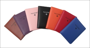 Multi-color PU leather RFID passport holders in a fan arrangement with aircraft icons