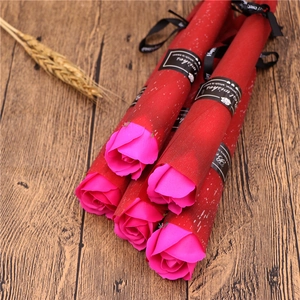 Detailed view of single soap roses in pink paper wrap with Best Wishes ribbons
